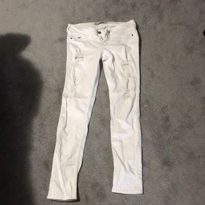 Distressed white jeans
